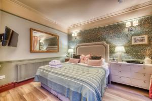 Ένα ή περισσότερα κρεβάτια σε δωμάτιο στο The Bluebell +10 φωτογραφίες