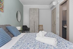 Ένα ή περισσότερα κρεβάτια σε δωμάτιο στο Conca D'Oro Guest House - Anna +12 φωτογραφίες