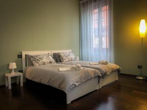 Ένα ή περισσότερα κρεβάτια σε δωμάτιο στο Casa Adelaide Rho Fiera