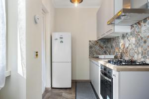 Η κουζίνα ή μικρή κουζίνα στο Conca D'Oro Guest House - Anna