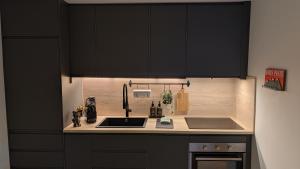 Η κουζίνα ή μικρή κουζίνα στο Nendaz Nest - Appartement moderne & confortable au cœur de Nendaz - 4 Vallées