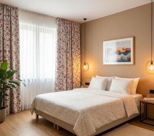 a bedroom with a bed and a large window at Trabzon Live Hotel in Bostancı +16 photos