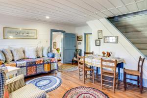 a living room with a couch and a table at Blue Ridge Retreat! Cottage on the Rapidan River in Locust Dale +17 photos