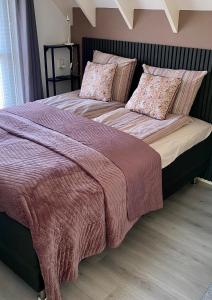 Ένα ή περισσότερα κρεβάτια σε δωμάτιο στο Bed en Bike Texel