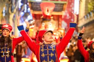 a group of girls in traditional costumes in a parade at ELEGANCE Castillet - Plein Centre Proche Gare Bus et Transports - IDEAL COUPLE ou PRO - Moderne et Confort - OFFRE SPECIALE in Perpignan