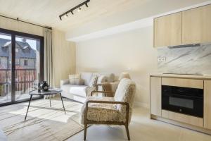a living room with a couch and a table at Cima Panticosa by BeValle in Panticosa +38 photos