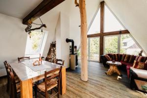 a living room with a table and a couch at Ferienhaus Lärchenblick in Kurort Altenberg