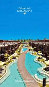 an aerial view of a resort with two pools at Naay Villas - Flat Beira mar exclusivo in Pôrto de Pedras