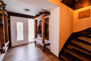 a hallway with a staircase in a house at Ferienhaus Lärchenblick in Kurort Altenberg