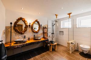 a bathroom with a sink and a toilet at Ferienhaus Lärchenblick in Kurort Altenberg +21 photos