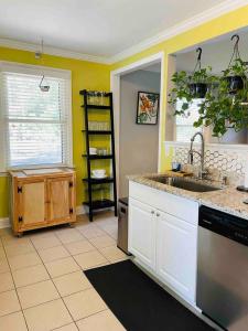 a kitchen with a sink and a counter top at Downtown - 2 bed, 1 bath - KC in Raleigh +10 photos