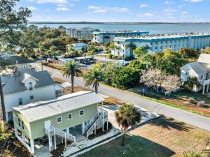 an aerial view of a town with houses and the ocean at Lime Time in Tybee Island