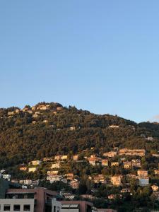 a town on a hill with houses on it at White Noise Como in Como