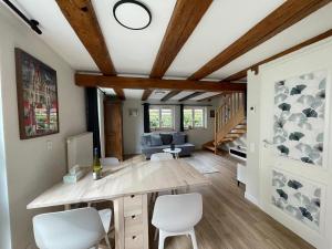 a living room with a table and two chairs at Cottage A day in Strasbourg in Strasbourg