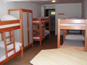a dorm room with several bunk beds in it at Refuge d'hiver de N&M in Tende