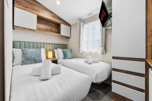 Ένα ή περισσότερα κρεβάτια σε δωμάτιο στο Cormorant View Hayling Island +26 φωτογραφίες