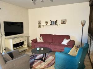 a living room with a couch and two chairs and a table at Fewo am Iberg 20, inkl Parkplatz in Willingen