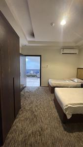 Ένα ή περισσότερα κρεβάτια σε δωμάτιο στο Malfa SERVICED APARTMENTS