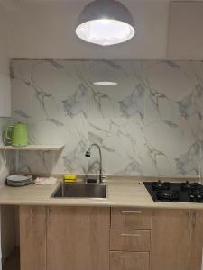 a kitchen with a sink and a counter top at Centro Historico Lima - Apartamento in Lima