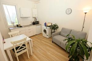 a living room with a couch and a table at Casanove212 in Casalecchio di Reno +4 photos