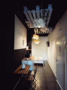 a room with a table and chairs and a bed at Cozy Room G20 in Valencia