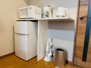 Kuchyň nebo kuchyňský kout v ubytování LuxurySweet 博多駅南51