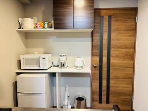Kuchyň nebo kuchyňský kout v ubytování LuxurySweet 博多駅南51
