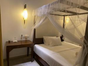 Postel nebo postele na pokoji v ubytování The Verandah