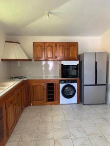 Kuchyň nebo kuchyňský kout v ubytování Villa Creole 3 Chambres votre Oasis à Sainte-Rose