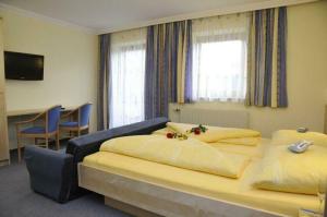 Giường trong phòng chung tại Appartementhaus Grillhofer