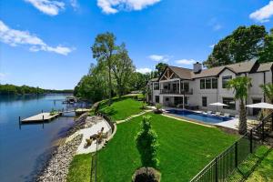 an aerial view of a large house with a body of water at Hogan Crest in Mooresville