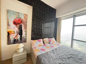 a bedroom with a bed and a painting on the wall at 1bhk Apartment With Swimming Sector 75 Noida in Noida