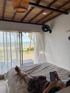 Postel nebo postele na pokoji v ubytování Casa jaguar frente al mar