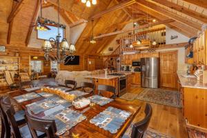 a dining room and kitchen with a table and chairs at Oakland Bear Lair in Oakland