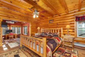 a bedroom with a bed in a log cabin at Oakland Bear Lair in Oakland +136 photos