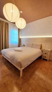 Ένα ή περισσότερα κρεβάτια σε δωμάτιο στο Casa Vacanze Da Nonna Isa