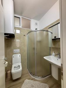 Ένα μπάνιο στο Kilometer 0 Comfortable Appartment