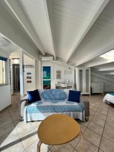 a bedroom with a bed and a table at Loft Sofi in Morro del Jable