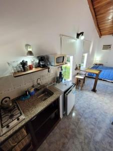 a kitchen with a sink and a counter top at El Zohar 2 pax in Federación +24 photos