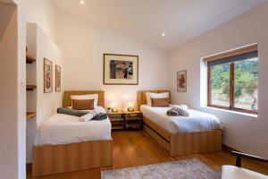 Voodi või voodid majutusasutuse FINCA TUTASUA Lake View Luxury House toas