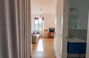 TV a/nebo společenská místnost v ubytování Casa Lumière