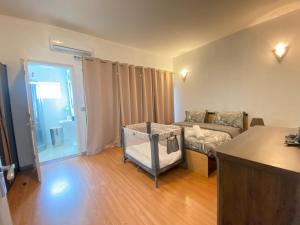 Ένα ή περισσότερα κρεβάτια σε δωμάτιο στο Waterside Complex - Beachfront Villa in Grand Baie +28 φωτογραφίες