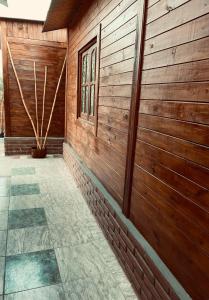 a hallway of a wooden building with a window at Cabañas El Zonda in Tinogasta