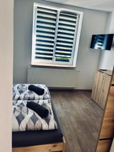 Ένα ή περισσότερα κρεβάτια σε δωμάτιο στο Na Zlaťáku