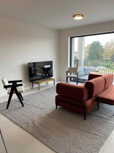 TV a/nebo společenská místnost v ubytování Luxury Apartment Antwerp Port Moerbeke 1