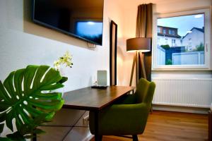 TV a/nebo společenská místnost v ubytování SANO - Hagen - Zentral, Ruhig, Stillvoll, Platz zum Arbeiten, Schnelles Internet