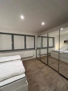 Ένα ή περισσότερα κρεβάτια σε δωμάτιο στο Ferienwohnung Eider