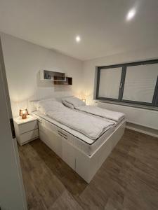 Ένα ή περισσότερα κρεβάτια σε δωμάτιο στο Ferienwohnung Eider