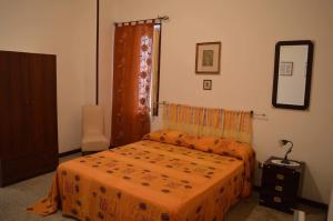 Casa Renata tesisinde bir odada yatak veya yataklar