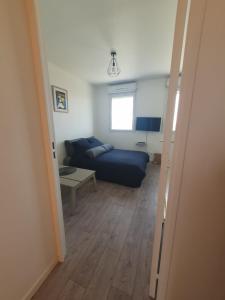 Posezení v ubytování Parenthèse confortable avec balcon et parking